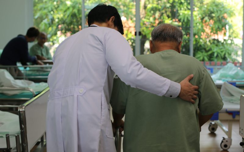 caretaker-helping-elderly-man-with-walking-physica-2025-01-29-08-16-31-utc